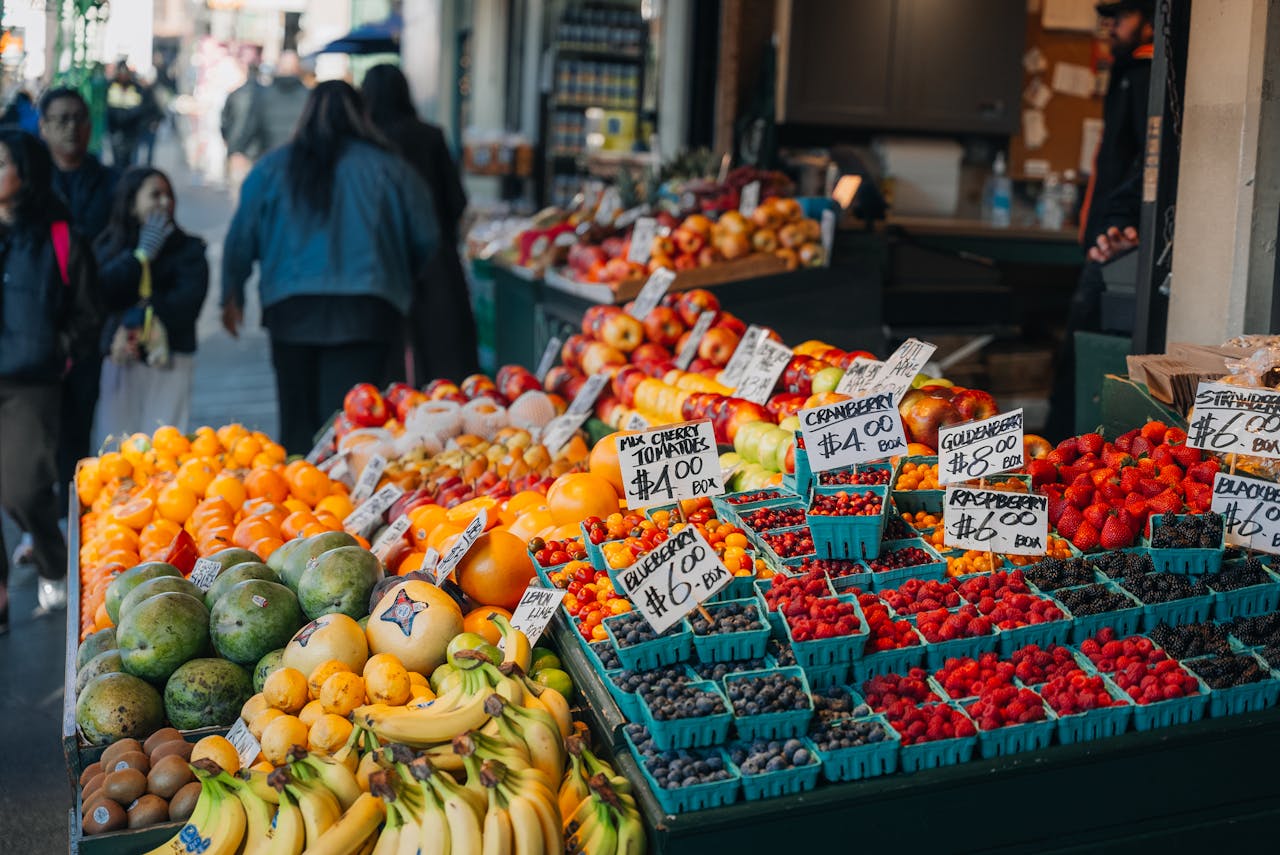 services-03 Colorful array of fruits at Seattle market, showcasing local produce and vibrant street life.