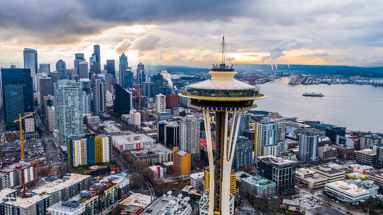 services-01 Stunning aerial shot of Seattle's skyline featuring the iconic Space Needle at sunset.
